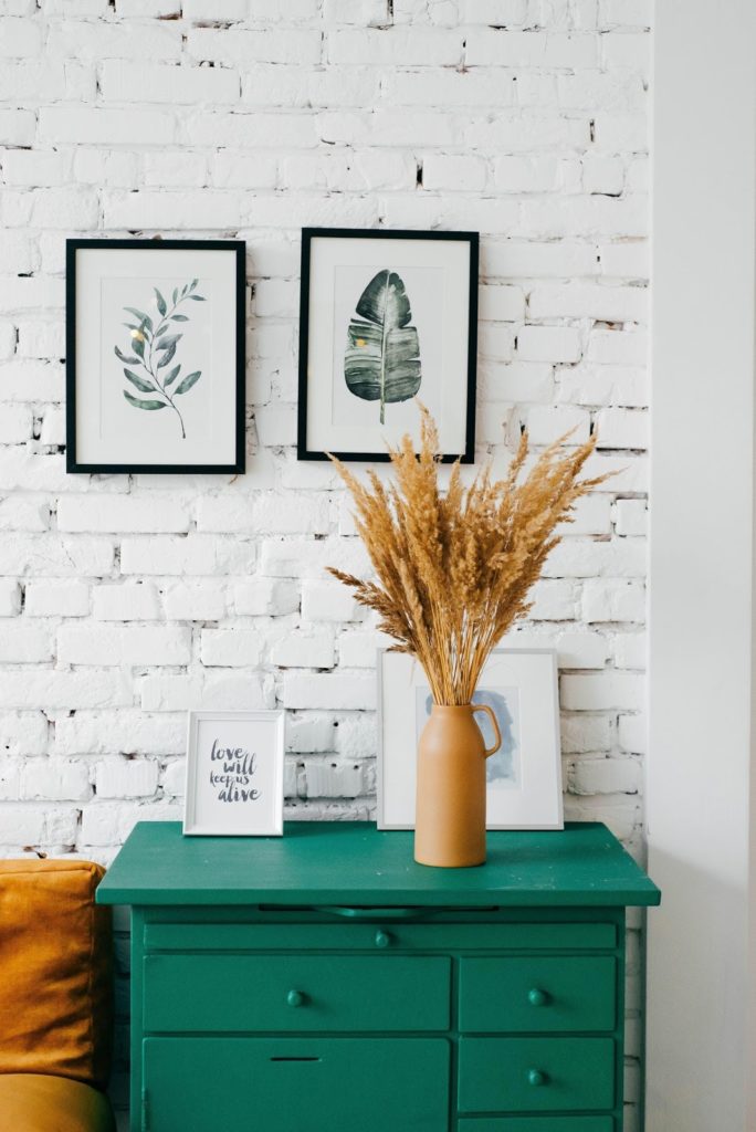 furniture in front of white brick wall