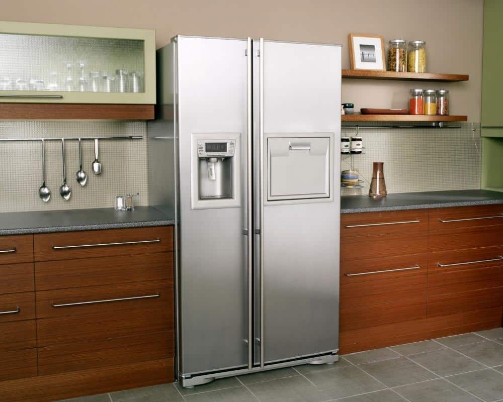 A refrigerator in a kitchen.