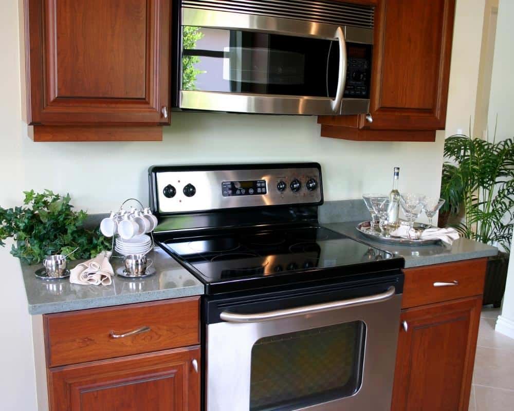 A built-in stove and microwave combo.