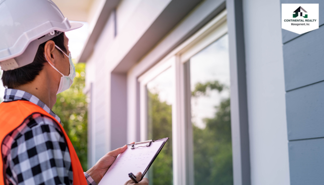 Man checking a house with a clipboard